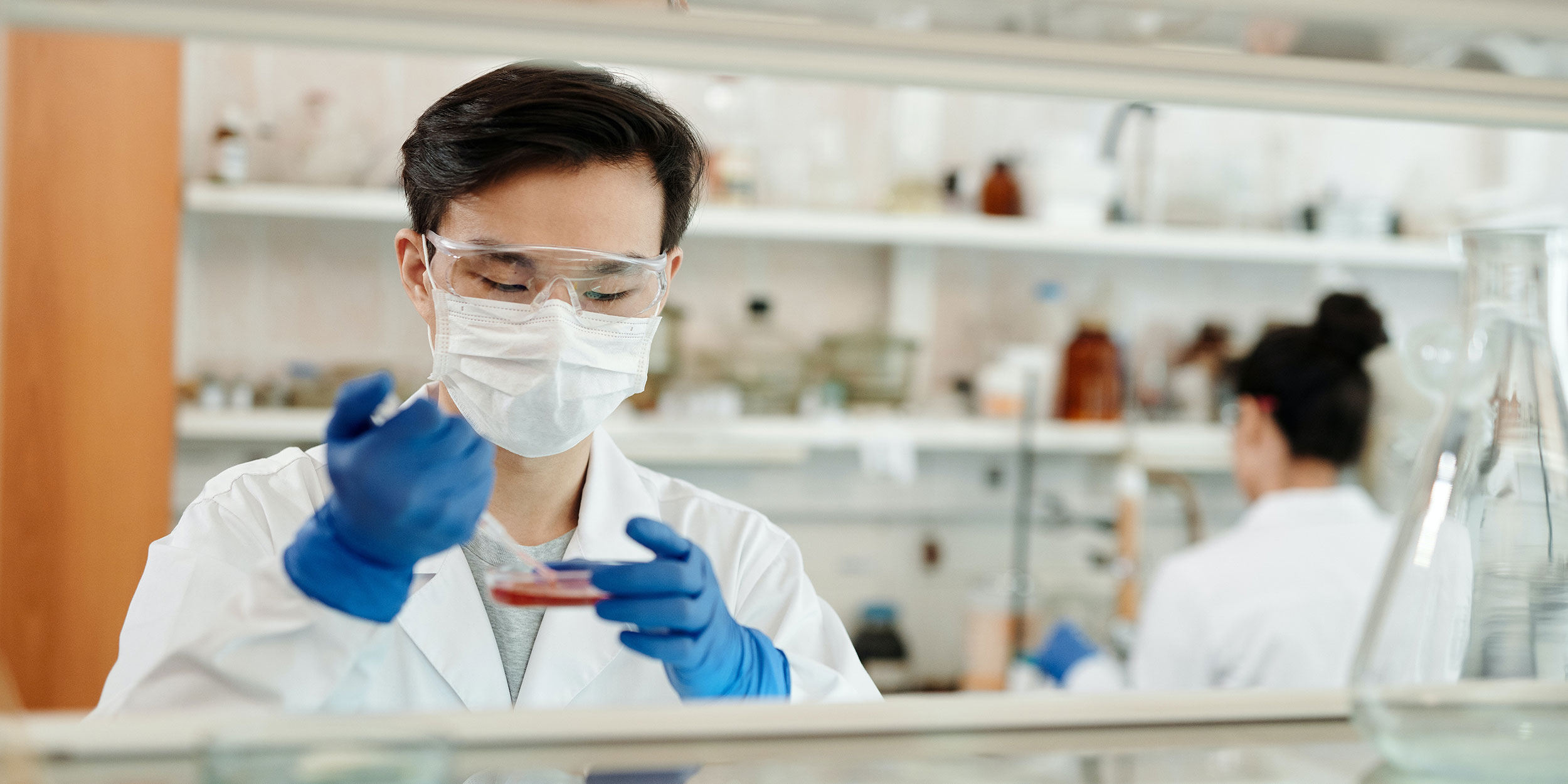 A researcher works in a lab