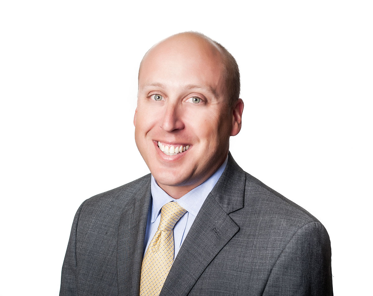 A headshot of a gentleman smiling in Wake County