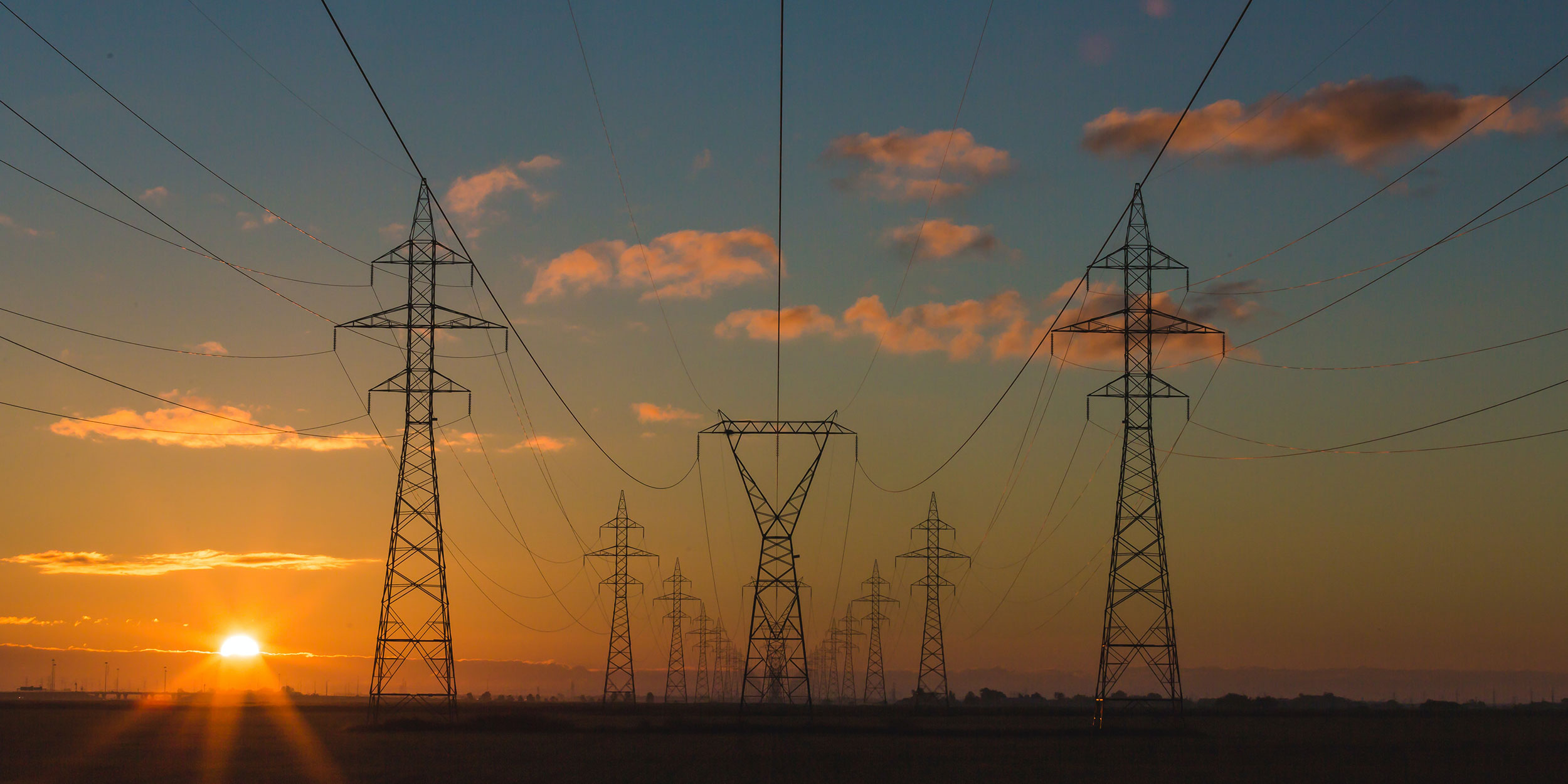 Electricity power lines at sunset